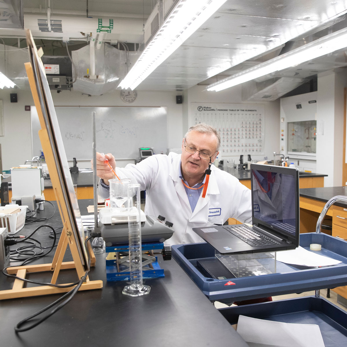 Professor conducting a lab session for his online students