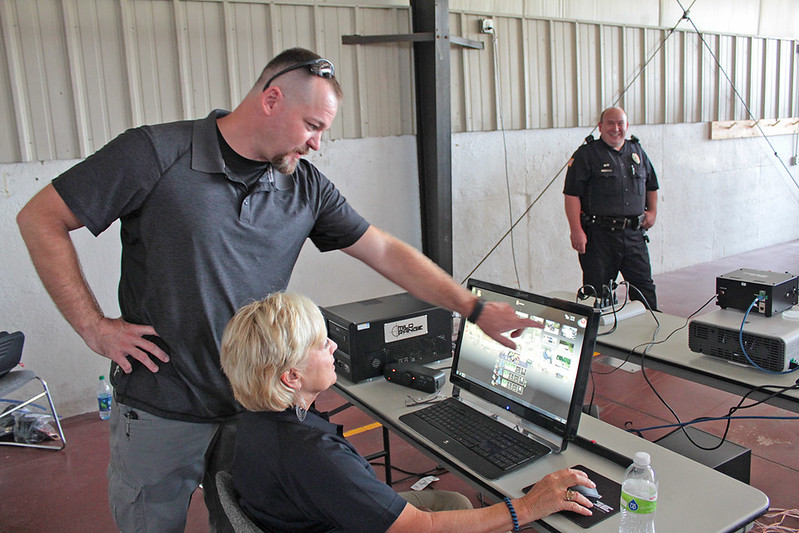 A man pointing at the computer screen in the public safety center