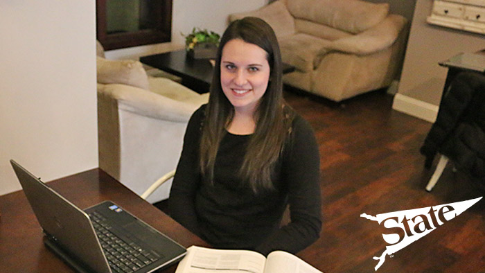 Female Missouri State student working at her laptop. 