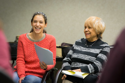 A teacher reading with a student