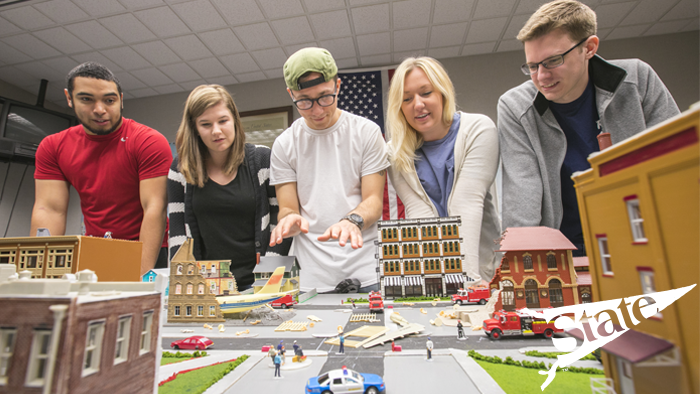 a group of students working on an economic development project