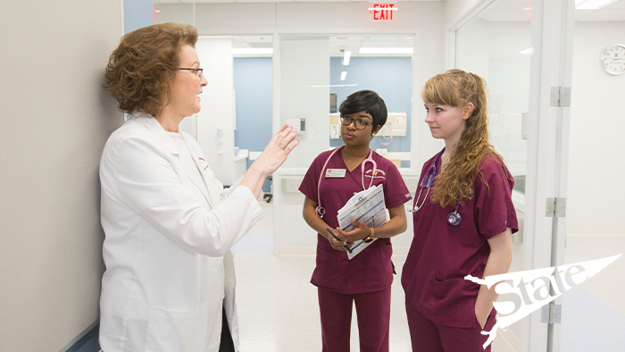 nursing students learning from a nurse educator