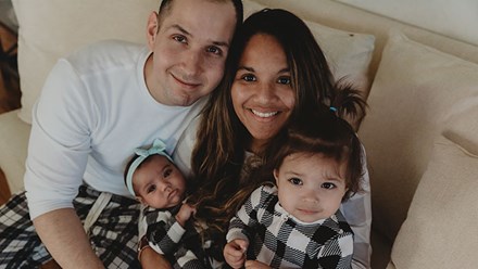 Captain Nick Martinez and his family sitting on a couch